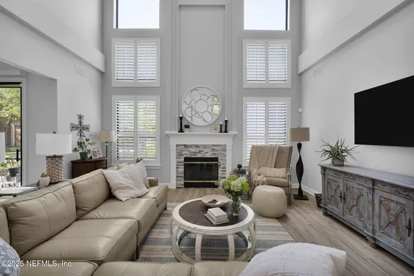 a living room with furniture and a fireplace