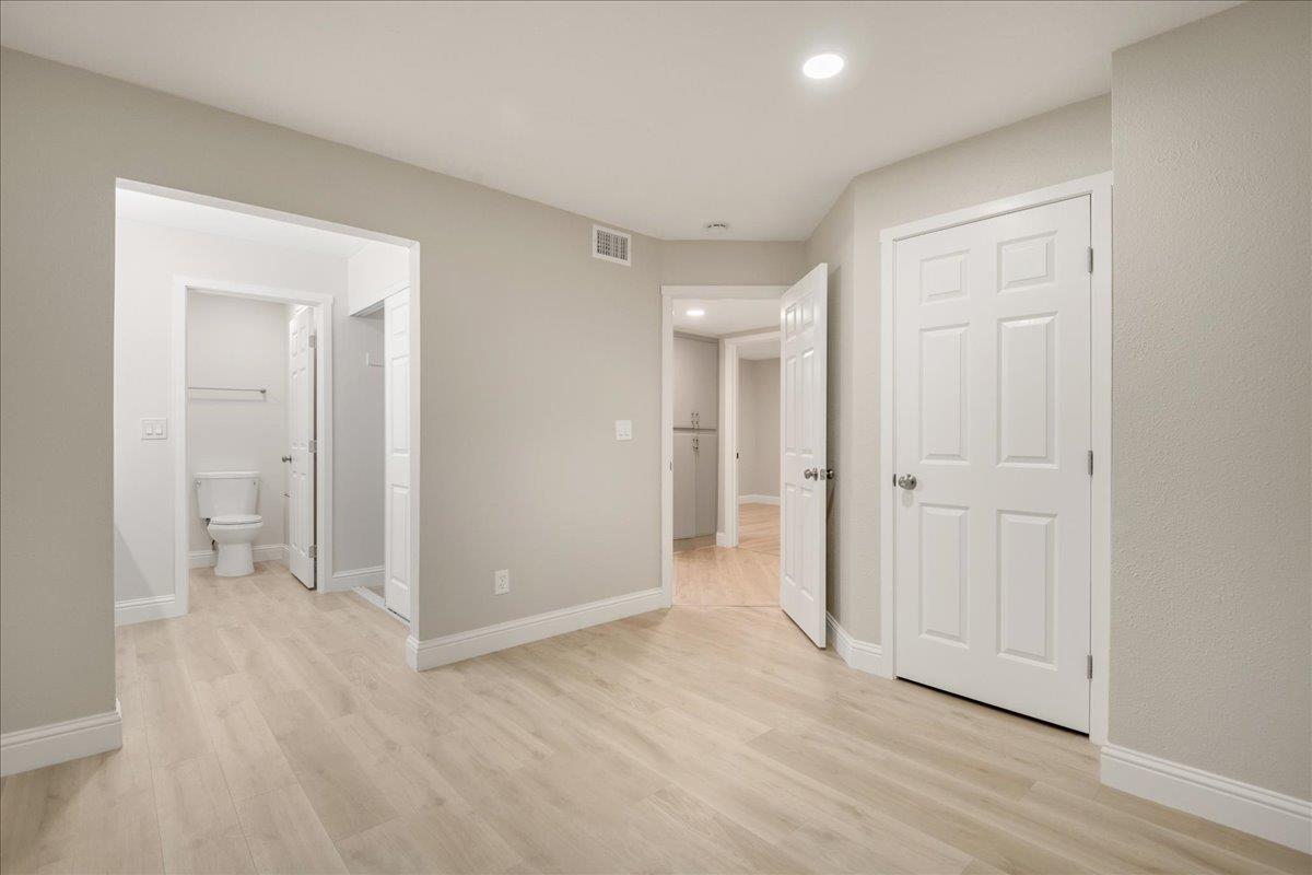 127 Rancho Drive San Jose, CA 95111 - Photo 15 of 25 a view of a room with wooden floor and closet area