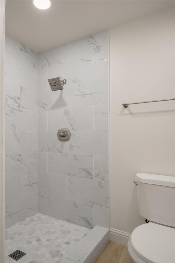 127 Rancho Drive San Jose, CA 95111 - Photo 17 of 25 a bathroom with a shower a toilet and sink