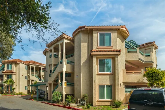 a front view of a house with parking