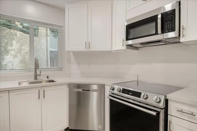 a kitchen with a stove and a microwave