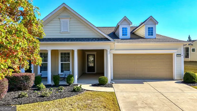 a front view of a house with garden