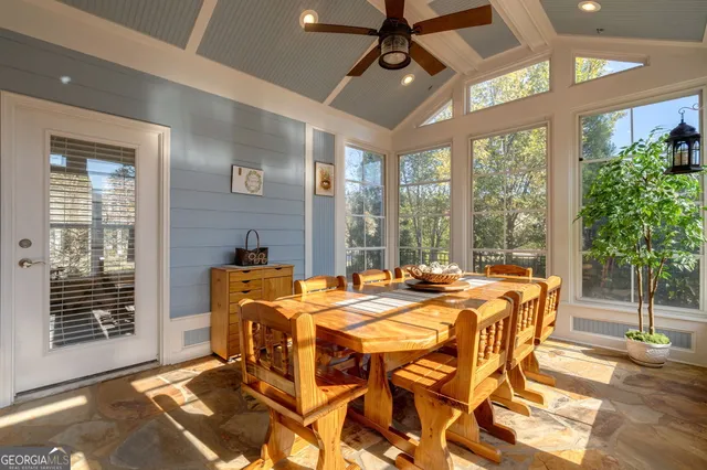 a dining room with a table and chairs