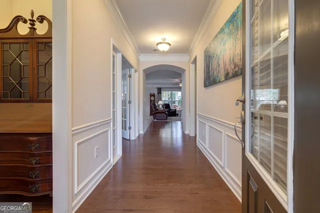 a view of a hallway view with wooden floor and staircase