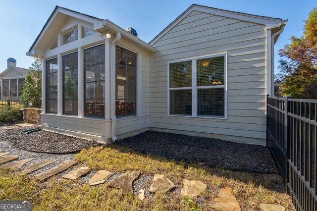 an aerial view of a house with a yard and balcony