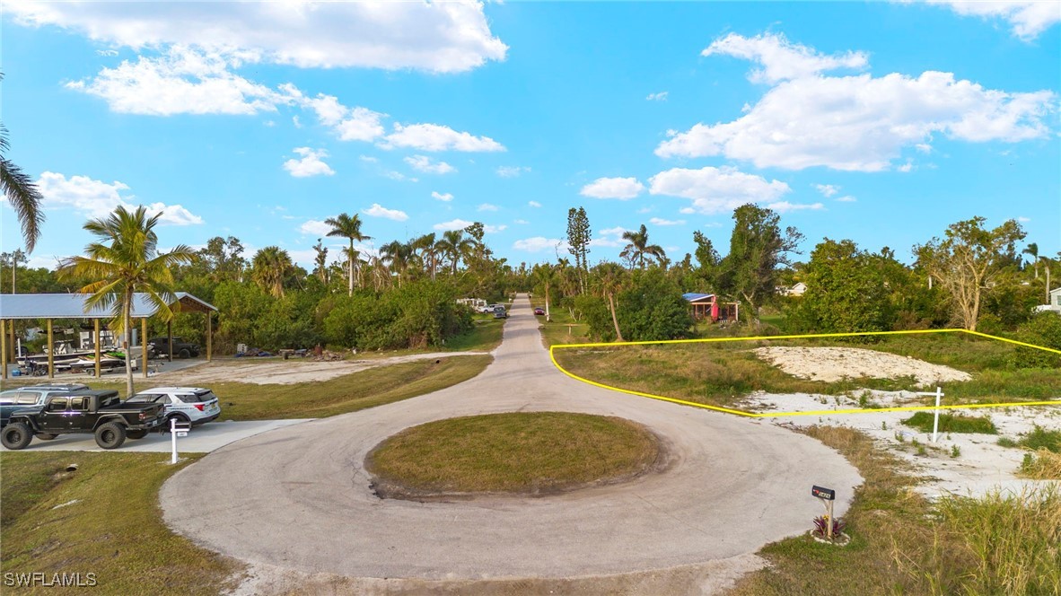 5476 Easy Street Bokeelia, FL 33922 - Photo 4 of 11 a view of a swimming pool with a yard