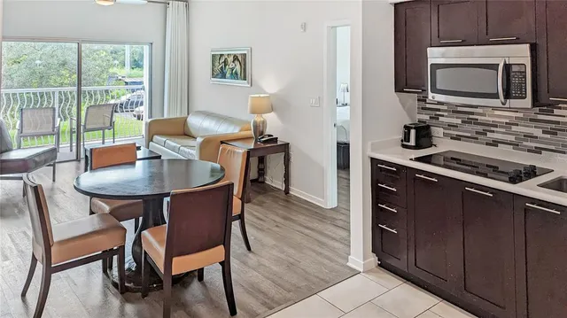 a kitchen with stainless steel appliances a refrigerator a stove a microwave and sink