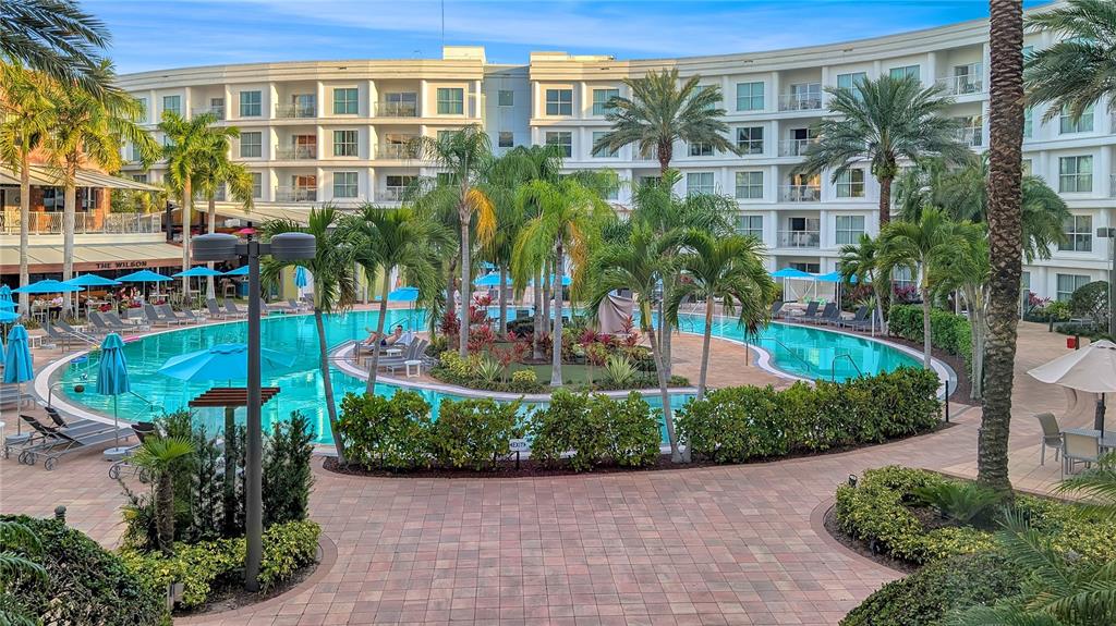 225 Celebration Place, Unit 212 Celebration, FL 34747 - Photo 32 of 35 a view of a building with a yard and plants