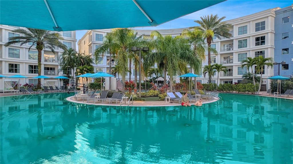 225 Celebration Place, Unit 212 Celebration, FL 34747 - Photo 6 of 35 a view of a house with a yard patio and swimming pool