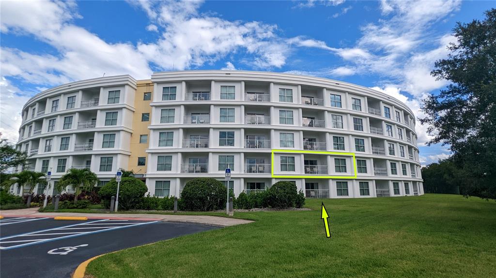 225 Celebration Place, Unit 212 Celebration, FL 34747 - Photo 9 of 35 a view of building with yard