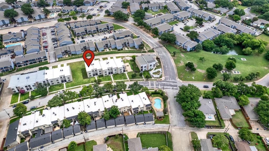 9471 Timberleaf Drive Dallas, TX 75243 - Photo 34 of 39 Aerial perspective showcasing multiple residential structures with gray roofs