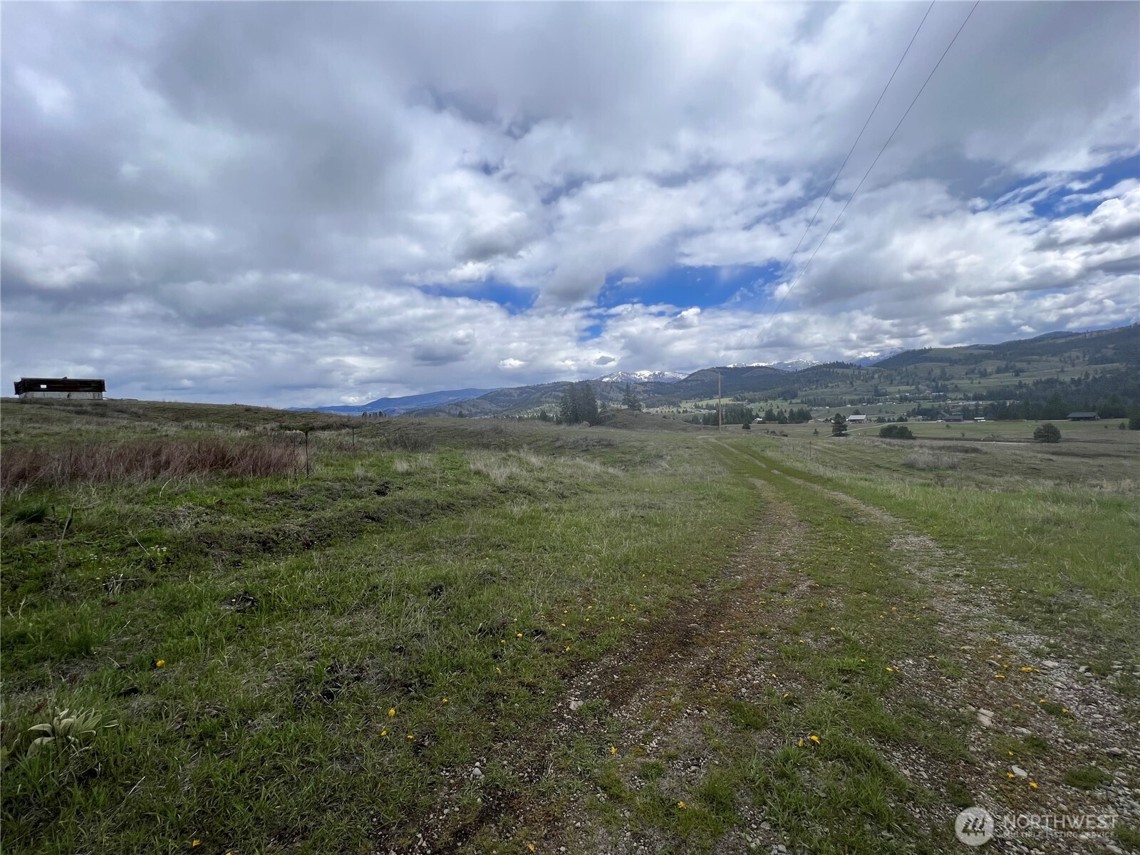 24 Spoke Lane Republic, WA 99166 - Photo 10 of 14 a view of a lake with a big yard