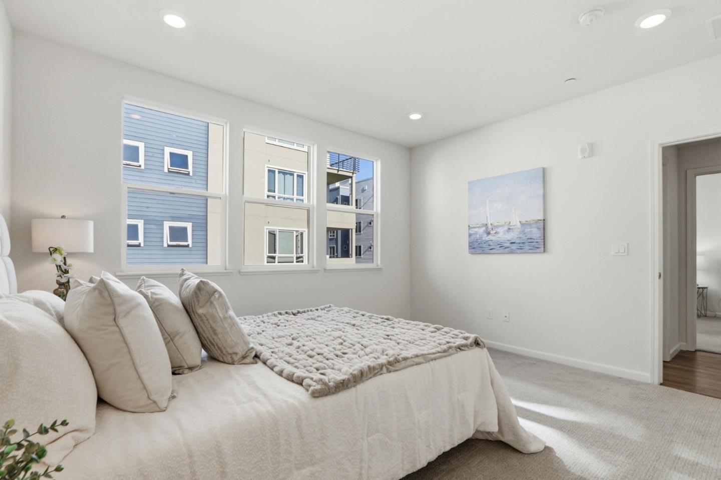 637 Clover Circle Milpitas, CA 95035 - Photo 16 of 39 a bedroom with a large bed and a window