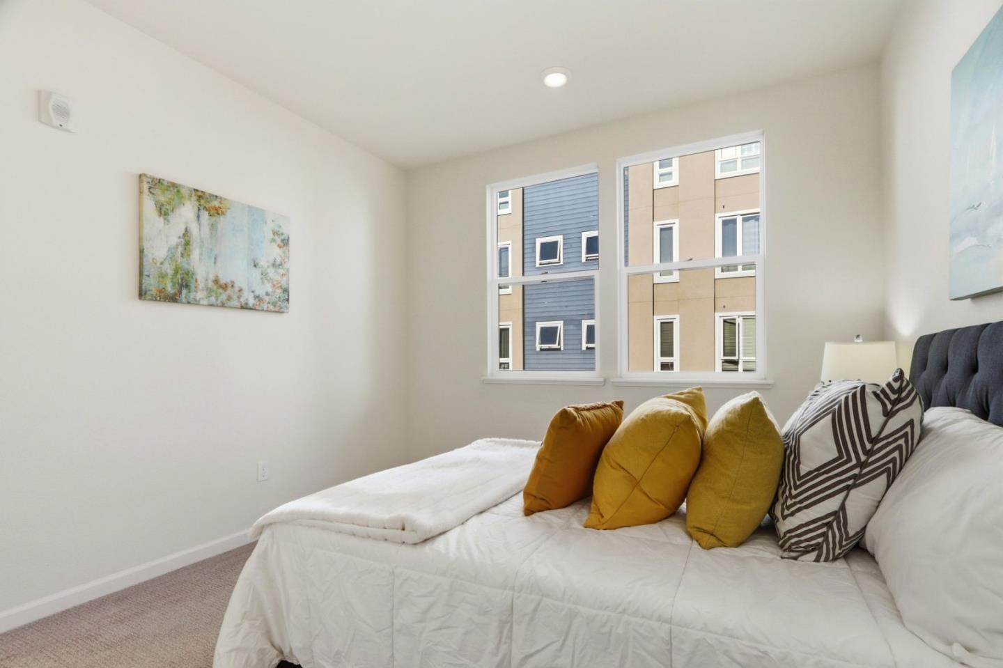 637 Clover Circle Milpitas, CA 95035 - Photo 20 of 39 a bedroom with a bed and glass windows