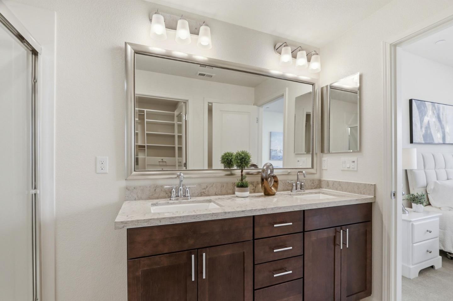637 Clover Circle Milpitas, CA 95035 - Photo 23 of 39 a bathroom with a double vanity sink and a mirror