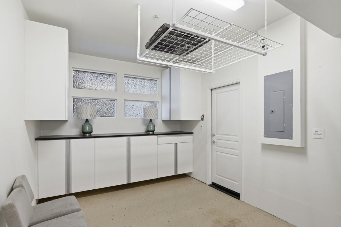 637 Clover Circle Milpitas, CA 95035 - Photo 25 of 39 a kitchen with white cabinets and window