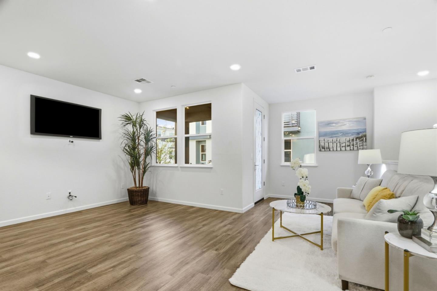 637 Clover Circle Milpitas, CA 95035 - Photo 4 of 39 a living room with furniture and a flat screen tv