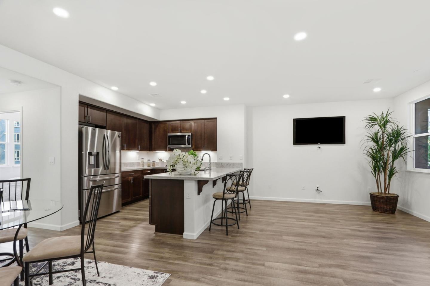 637 Clover Circle Milpitas, CA 95035 - Photo 6 of 39 a view of a dining room with furniture window and wooden floor