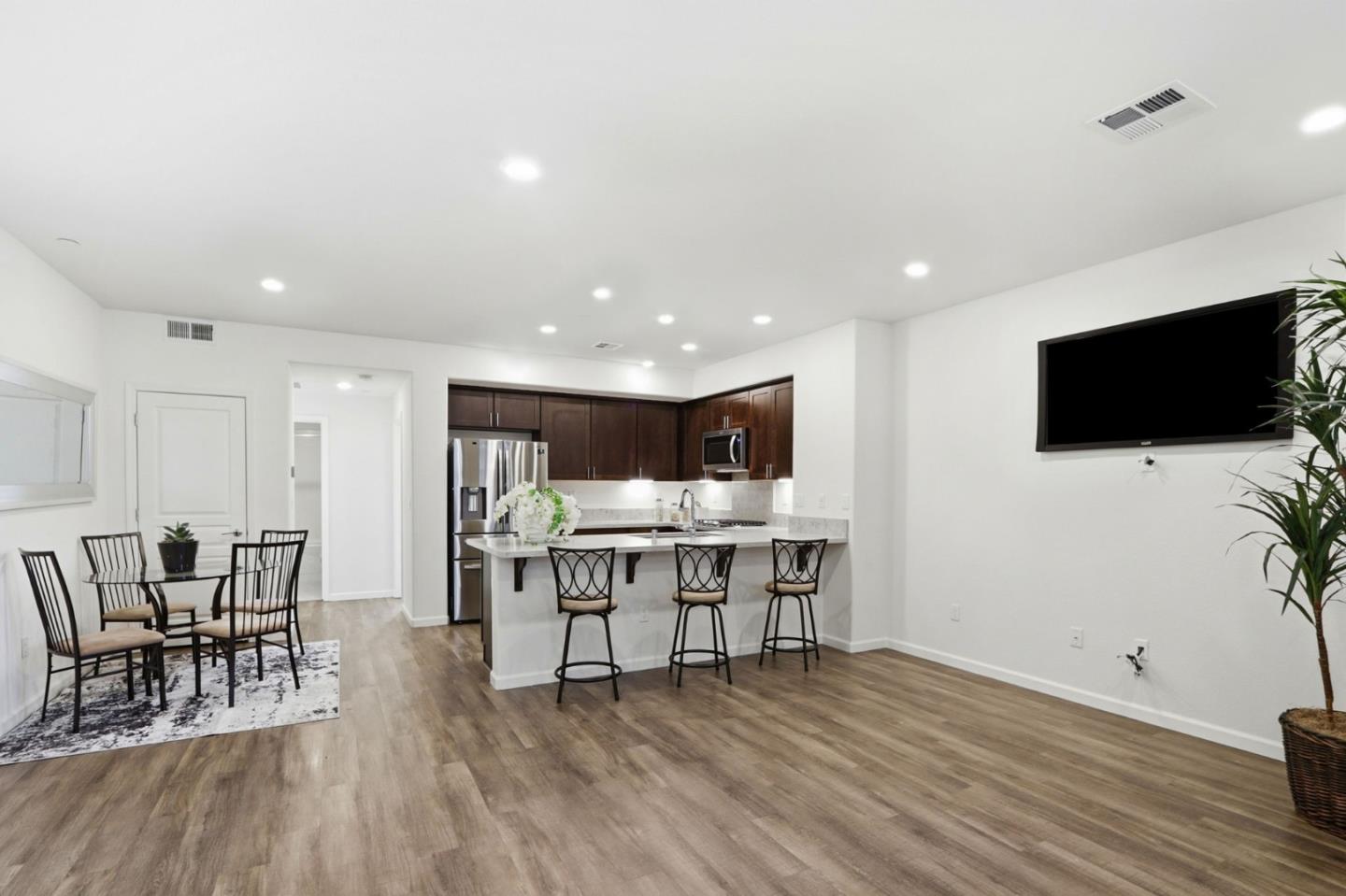 637 Clover Circle Milpitas, CA 95035 - Photo 7 of 39 a view of a livingroom with furniture and a flat screen tv