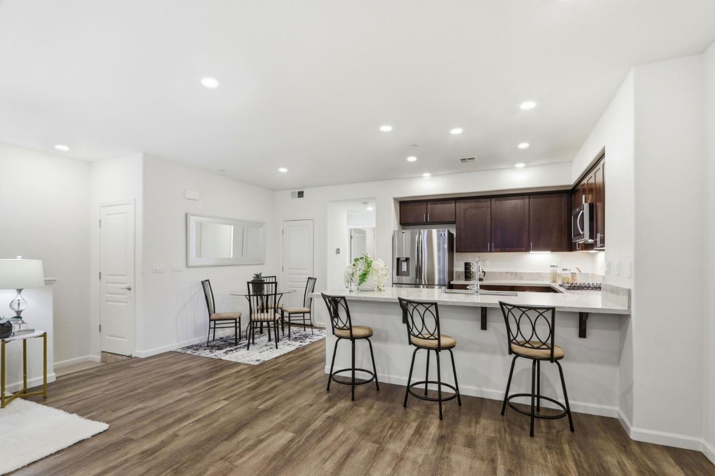 637 Clover Circle Milpitas, CA 95035 - Photo 9 of 39 a view of a dining room with furniture and wooden floor