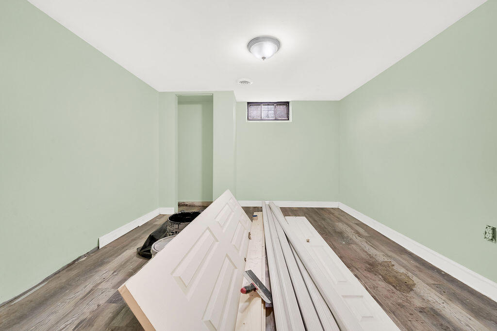 4084 Tyler Street Gary, IN 46408 - Photo 16 of 21 a view of a bedroom with wooden floor