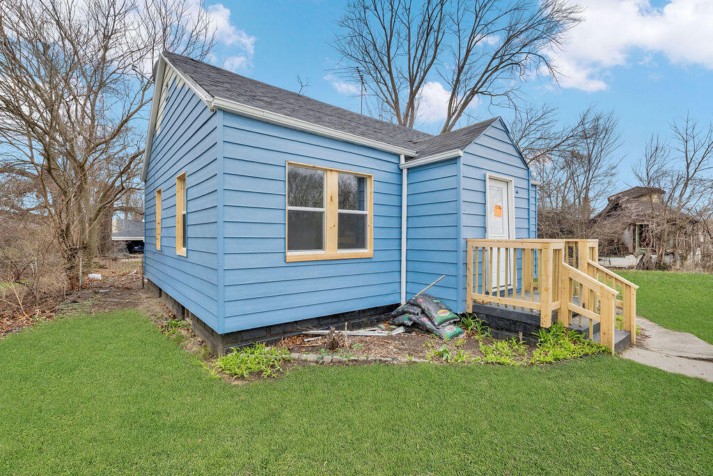 4084 Tyler Street Gary, IN 46408 - Photo 18 of 21 a view of a backyard with wooden fence and a large tree
