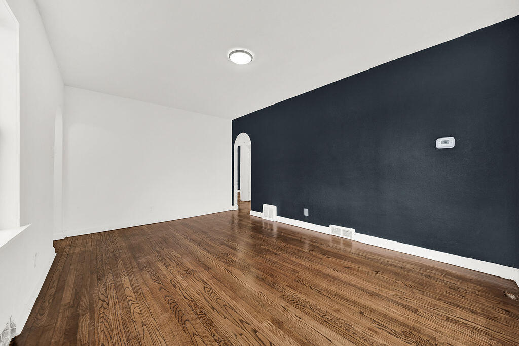 4084 Tyler Street Gary, IN 46408 - Photo 6 of 21 a view of an empty room with wooden floor