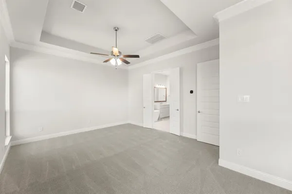 a view of a room with a ceiling fan