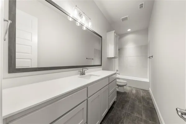 a bathroom with a sink and a bathtub