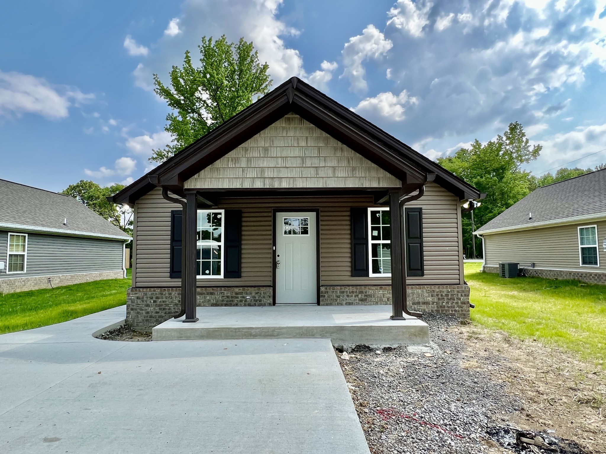120 Liberty Street Portland, TN 37148 - Photo 2 of 12 a front view of a house with garden
