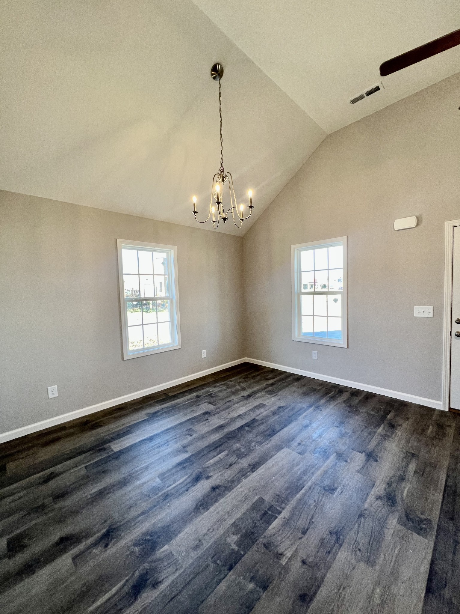120 Liberty Street Portland, TN 37148 - Photo 3 of 12 a view of an empty room with wooden floor and a window