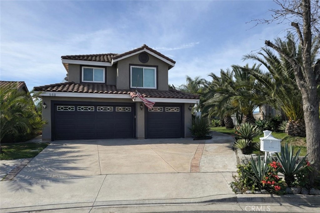 560 Calhoun Street Corona, CA 92879 - Photo 1 of 1 a front view of a house with a garage