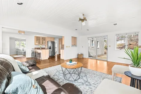 a dining room with furniture window wooden floor