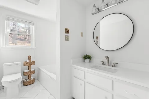 a bedroom with a bed and a table