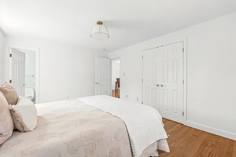a bathroom with a sink toilet vanity and shower