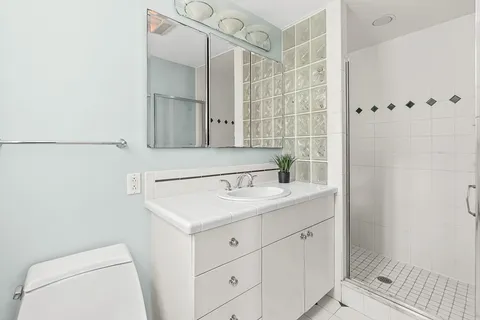 a spacious bedroom with a bed and a couch