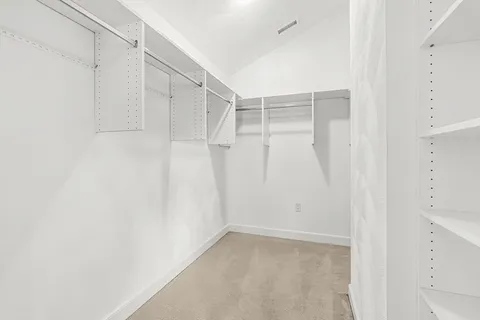 a bed room with a bed and a night stand