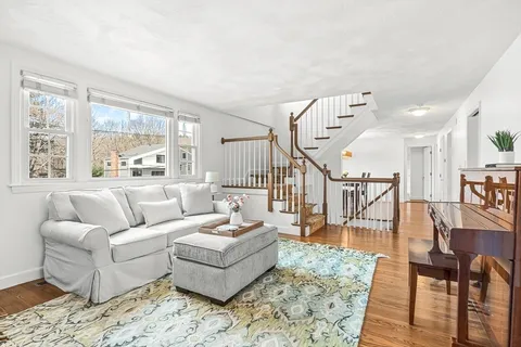 a living room with furniture and a rug