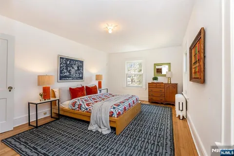 a bedroom with a bed and a table