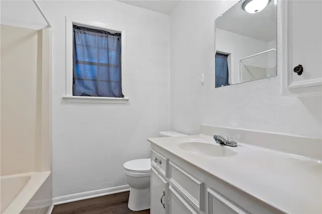 a bathroom with a sink and a toilet