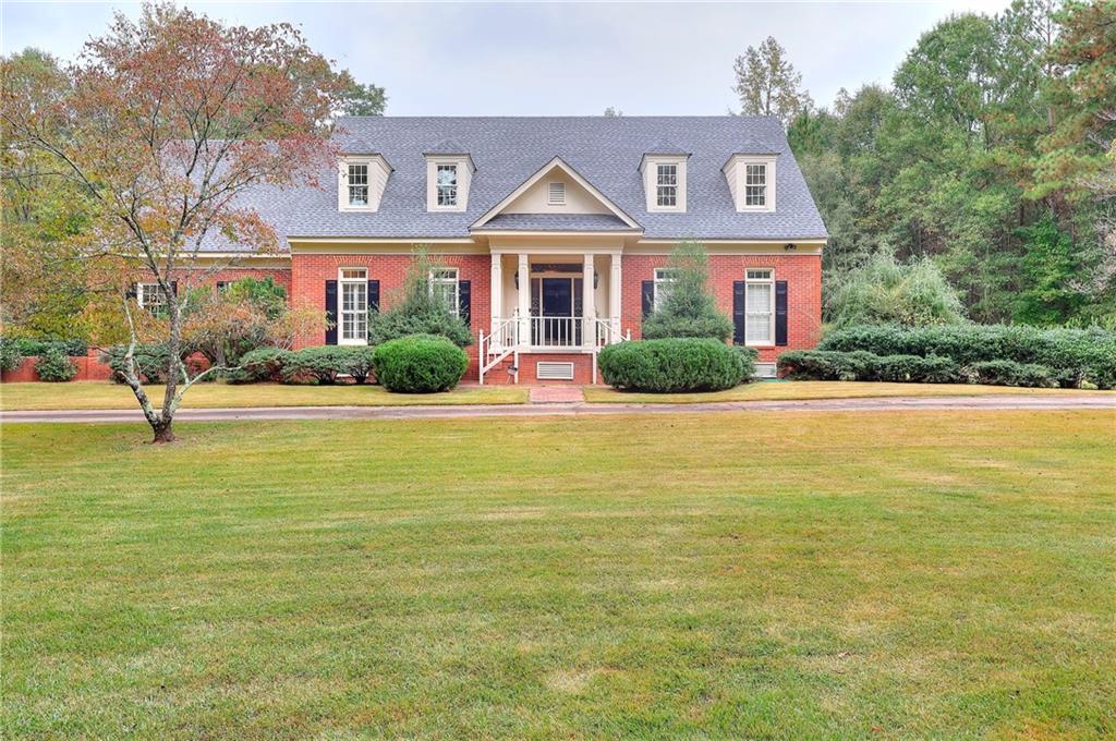 a front view of a house with a yard