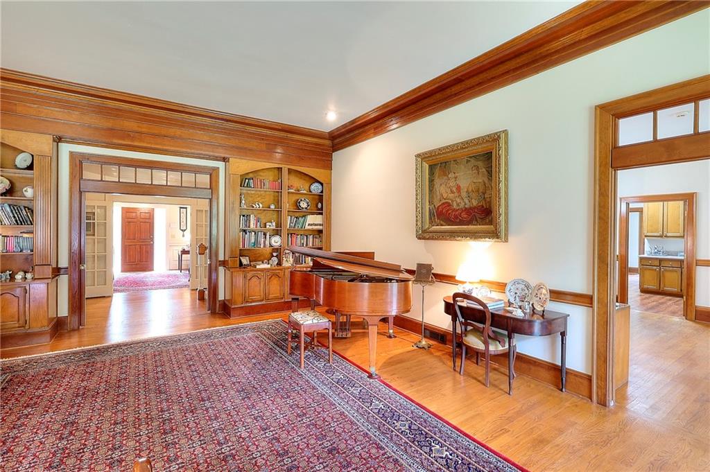 600 River Cove Road Social Circle, GA 30025 - Photo 11 of 45 a living room with furniture a rug and painting on the wall