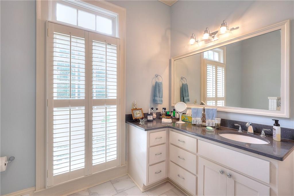 600 River Cove Road Social Circle, GA 30025 - Photo 15 of 45 a bathroom with double vanity and a mirror