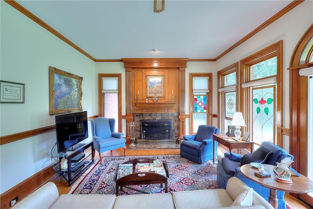 600 River Cove Road Social Circle, GA 30025 - Photo 21 of 45 a living room with furniture a fireplace and a large window