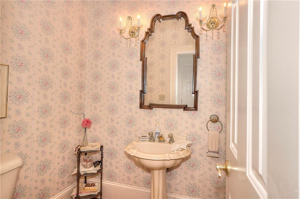 600 River Cove Road Social Circle, GA 30025 - Photo 26 of 45 a bathroom with a sink and a mirror