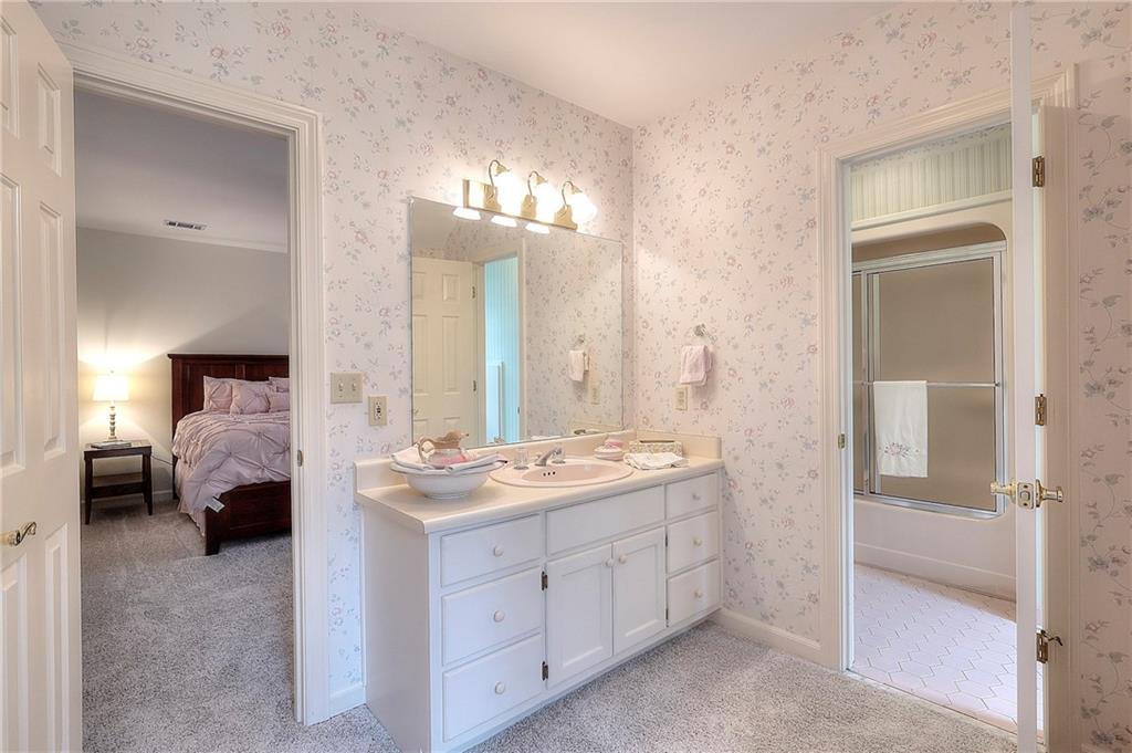 600 River Cove Road Social Circle, GA 30025 - Photo 35 of 45 a en suite bathroom with a double sink and mirror