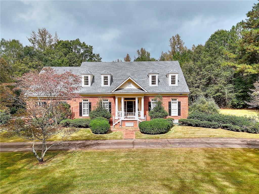 600 River Cove Road Social Circle, GA 30025 - Photo 37 of 45 a front view of a house with garden