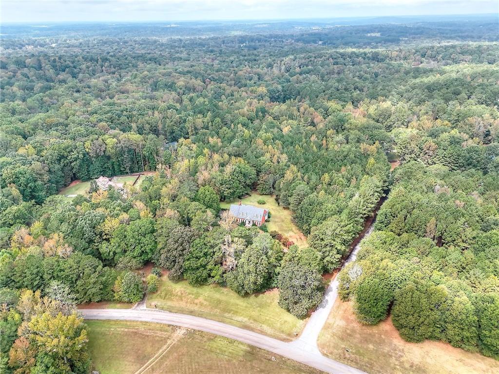 600 River Cove Road Social Circle, GA 30025 - Photo 39 of 45 a view of a city with lush green forest
