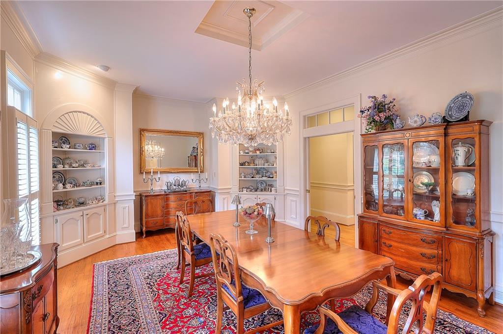 600 River Cove Road Social Circle, GA 30025 - Photo 5 of 45 a view of a dining room with furniture and wooden floor