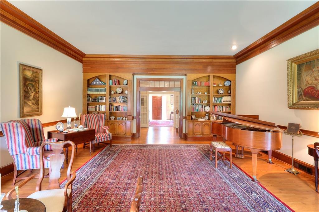 600 River Cove Road Social Circle, GA 30025 - Photo 10 of 45 a living room with furniture a rug and a dining table